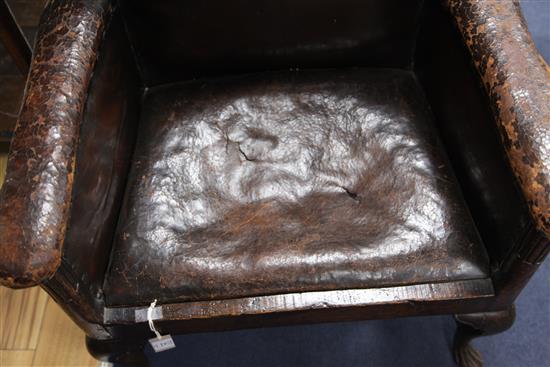 An 18th century boarded oak framed armchair,